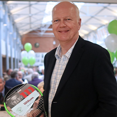 supporter with out traditional green and black racket